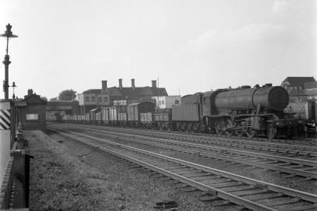 BR WD class 90036 at Kenton Station, Greater London with a Southbound Goods on Monday 12 Jul 1954 - J.H.W. Kent [154618]