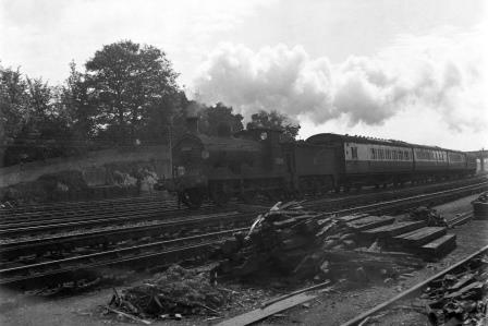 BR(S) C class 31585 passing Preston Park Pullman Car Works, East Sussex with a Hastings - Brighton - Birkenhead service circa 01 Aug 1954 - J.H.W. Kent [154668]