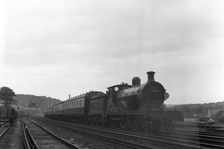 BR(S) D class 31737 passing Preston Park Pullman Car Works, East Sussex with a Birkenhead - Brighton - Hastings service on Sunday 01 Aug 1954 - J.H.W. Kent [154729]