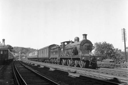 BR(S) D class 31737 passing Preston Park Pullman Car Works, East Sussex with a Birkenhead - Brighton - Hastings service on Tuesday 31 Aug 1954 - J.H.W. Kent [154741]