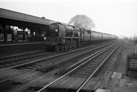 BR(S) West Country class 34010 'Sidmouth' at Raynes Park Station, Greater London with a Bournemouth - Waterloo service circa 09 Oct 1959 - D. Esau [155045]