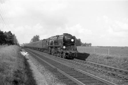 BR(S) West Country class 34018 'Axminster' at Beaulieu Road, Hampshire with a Waterloo - Bournemouth service on Sunday 18 Sep 1960 - D. Esau [155231]