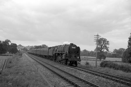9F class near Blandford Forum, Dorset with a Southbound service on Saturday 19 Aug 1961 - D. Esau [155714]