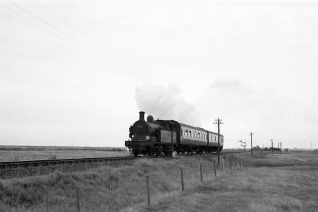 BR(S) H class 31518 near Stoke Junction Halt, Kent with an Allhallows - Gravesend service on Saturday 30 Sep 1961 - D. Esau [155907]
