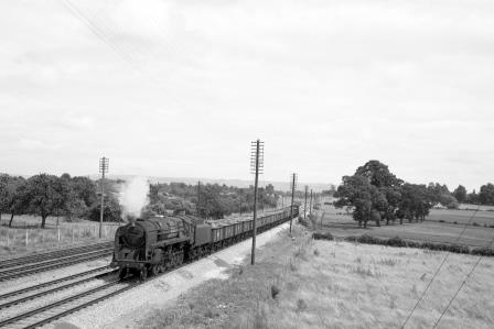 BR 9F class 92004 near Standish Junction, Gloucestershire with a Mineral in the 1960s - D. Esau [157980]