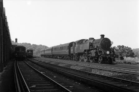 BR Std 4MT class 80084 passing Preston Park Pullman Car Works, East Sussex with a Birkenhead - Brighton - Hastings service on Wednesday 14 Jun 1961 - J.H.W. Kent [200678]