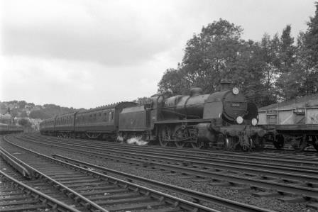 BR(S) N class 31410 passing Preston Park Pullman Car Works, East Sussex with a LMR - Brighton via Kensington Olympia service on Friday 11 Aug 1961 - J.H.W. Kent [200729]