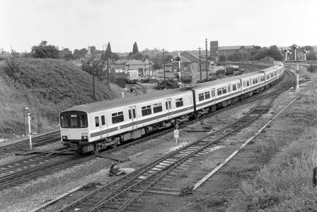 BR(W) Class 150 150128 at Sutton Bridge Junction, Greater London with the 8.12am Birmingham - Pwhelli service on Saturday 25 Jul 1987 - J. Scrace [233773]