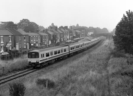 BR(W) Class 150 150131 at Sutton Bridge Junction, Greater London with the 8.12am Birmingham - Pwhelli service on Saturday 22 Aug 1987 - J. Scrace [233780]