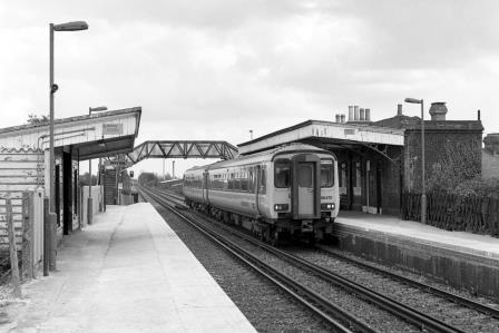 BR(S) Class 156 156470 at Portchester Station, Hampshire with the 1.10pm Portsmouth Harbour - Cardiff service on Friday 14 Apr 1989 - J. Scrace [233907]