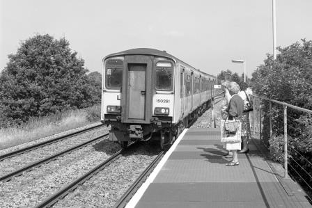BR(S) Class 150 150261 at Dilton Marsh Station, Wiltshire with the 10.31am Bristol - Southampton service on Tuesday 17 Aug 1993 - J. Scrace [233988]