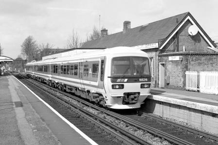 NSE Class 166 166216 at Reigate Station, Surrey with the 9.33am Reading - Gatwick Airport service on Thursday 24 Mar 1994 - J. Scrace [234036]