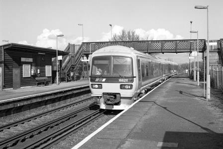 NSE Class 166 166211 at Salfords Station, Surrey with the 9.34am Reading - Gatwick Airport service on Tuesday 27 Feb 1996 - J. Scrace [234115]