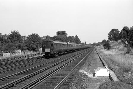 BR(S) Class 4-COR 3115 at Clapham Cutting, Greater London with the 12.10pm Waterloo - Portsmouth Harbour service on Saturday 25 Jul 1964 - J. Scrace [234287]